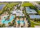 Overhead view of the clubhouse with pools, tennis and basketball courts, and other amenities at 6227 Golden Nettle Dr, Apollo Beach, FL 33572