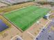 Aerial view of a large, well-maintained sports field with soccer and football markings, and a small building nearby at 6227 Golden Nettle Dr, Apollo Beach, FL 33572