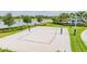 Well-maintained sand volleyball court next to the lake, perfect for outdoor fun and recreation at 6227 Golden Nettle Dr, Apollo Beach, FL 33572