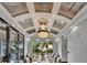 Formal dining room features a large table and seating under an elegant chandelier at 6526 Surfside Blvd, Apollo Beach, FL 33572