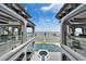 The house features multiple balconies with seating areas and beautiful waterfront views, with a pool and hot tub on the grounds at 6526 Surfside Blvd, Apollo Beach, FL 33572