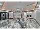 Spacious garage featuring marble floors, recessed lighting, and ample parking space at 6526 Surfside Blvd, Apollo Beach, FL 33572
