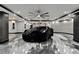 Spacious garage featuring marble floors, modern lighting, and ample parking space at 6526 Surfside Blvd, Apollo Beach, FL 33572
