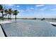 An expansive infinity pool blends seamlessly with the ocean horizon at 6526 Surfside Blvd, Apollo Beach, FL 33572