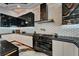 Modern kitchen with stainless steel appliances, sleek cabinetry, and decorative backsplash at 6526 Surfside Blvd, Apollo Beach, FL 33572