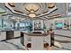 Luxury kitchen with large island, modern appliances, custom ceiling and marble floors at 6526 Surfside Blvd, Apollo Beach, FL 33572