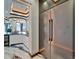 Gourmet kitchen with stainless steel refrigerator and wine storage; featuring modern design elements at 6526 Surfside Blvd, Apollo Beach, FL 33572