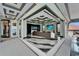 Expansive living area boasts floor-to-ceiling glass doors, a luxurious sofa, and stunning views of the outdoor scenery at 6526 Surfside Blvd, Apollo Beach, FL 33572