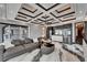 Spacious living room with designer furnishings, modern ceiling and open floor plan to kitchen and balcony at 6526 Surfside Blvd, Apollo Beach, FL 33572