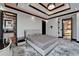 Tastefully designed bedroom with marbled floors and a modern tray ceiling with accent lighting at 6526 Surfside Blvd, Apollo Beach, FL 33572