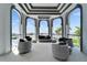 An elegantly designed patio with comfortable seating and scenic waterfront views at 6526 Surfside Blvd, Apollo Beach, FL 33572