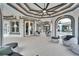 An elegantly designed patio with comfortable seating, arches, and scenic views at 6526 Surfside Blvd, Apollo Beach, FL 33572