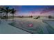 Captivating pool with water features offering serene waterfront views and stunning sunset colors at 6526 Surfside Blvd, Apollo Beach, FL 33572