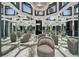 Unique mirrored room featuring stylish seating and geometric design at 6526 Surfside Blvd, Apollo Beach, FL 33572