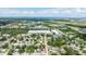 An aerial view shows the home in a residential neighborhood close to Tampa Bay and downtown St. Petersburg, Florida at 6816 S Hesperides St, Tampa, FL 33616