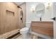 Modern bathroom featuring a stylish vanity, sleek black fixtures, and a glass shower at 6816 S Hesperides St, Tampa, FL 33616
