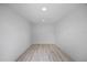 Empty room featuring wood flooring and recessed lighting at 6816 S Hesperides St, Tampa, FL 33616