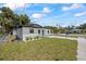 Cozy single-story house featuring a new driveway and a freshly landscaped front yard at 6816 S Hesperides St, Tampa, FL 33616