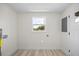 Laundry room featuring tile floors and a window for natural light at 6816 S Hesperides St, Tampa, FL 33616