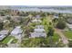 Lovely aerial view of the homes in a waterfront neighborhood, featuring tree-lined streets and manicured lawns at 7224 Park S St, St Pete Beach, FL 33707