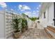 Cozy backyard featuring stone pathway and decorative fence at 7224 Park S St, St Pete Beach, FL 33707