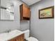 Updated bathroom features a modern vanity, toilet, and decorative mirror at 7224 Park S St, St Pete Beach, FL 33707