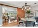 Open-concept dining room with barn door and views into the living room at 7224 Park S St, St Pete Beach, FL 33707