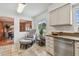 Bright and airy kitchen with granite countertops, stainless steel appliances, and a charming sitting area at 7224 Park S St, St Pete Beach, FL 33707