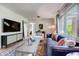 Well-lit living room with large flat screen TV, stylish furnishings, and a comfortable atmosphere at 7224 Park S St, St Pete Beach, FL 33707