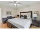 Comfortable bedroom features natural light through a large window and a cozy ceiling fan at 7224 Park S St, St Pete Beach, FL 33707