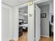 Cozy main bedroom featuring a ceiling fan and hardwood flooring visible through the doorway at 7224 Park S St, St Pete Beach, FL 33707
