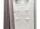 Clean, bright shower features a gray shower curtain and is easy to clean at 7224 Park S St, St Pete Beach, FL 33707