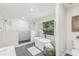 Spa-like bathroom featuring freestanding tub, shower, and a view to the outdoors at 731 38Th N Ave, St Petersburg, FL 33704