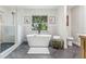 Luxurious bathroom featuring a soaking tub, walk-in shower, and modern fixtures at 731 38Th N Ave, St Petersburg, FL 33704