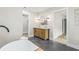 Large bathroom featuring double vanity, soaking tub, shower, and modern fixtures at 731 38Th N Ave, St Petersburg, FL 33704