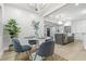 Dining room with table setting and decor open to modern kitchen with island and stainless appliances at 731 38Th N Ave, St Petersburg, FL 33704