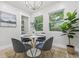 Bright dining room features modern chandelier, table with seating for four and ample natural light at 731 38Th N Ave, St Petersburg, FL 33704