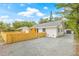 Well-maintained home with a gravel driveway and a detached garage offers privacy and convenience at 731 38Th N Ave, St Petersburg, FL 33704