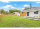 Attractive home with a spacious lawn, new fence, and charming walkway for easy access at 731 38Th N Ave, St Petersburg, FL 33704