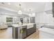 Bright kitchen features a center island with a farmhouse sink, stainless appliances, and ample cabinetry at 731 38Th N Ave, St Petersburg, FL 33704