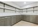 Spacious pantry with gray cabinets, white counters, open shelves, and wood floor at 731 38Th N Ave, St Petersburg, FL 33704