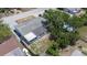 Aerial view of the property showing the layout of the house, backyard, and surrounding trees at 7330 Abalone Dr, Port Richey, FL 34668