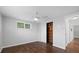 Cozy bedroom with hardwood floors, ceiling fan, and closet space at 7330 Abalone Dr, Port Richey, FL 34668