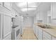 Bright kitchen featuring modern appliances, ample counter space, and tile flooring at 7330 Abalone Dr, Port Richey, FL 34668