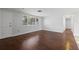 Inviting living room with hardwood floors, natural light and a welcoming atmosphere at 7330 Abalone Dr, Port Richey, FL 34668