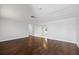 Spacious living room featuring laminate wood floors and lots of space at 7330 Abalone Dr, Port Richey, FL 34668