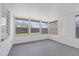 Enclosed sunroom featuring multiple windows offering a bright and airy space at 7330 Abalone Dr, Port Richey, FL 34668