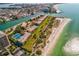 An aerial view of the complex with stunning views of the beach and waterway surrounding the island at 7564 Bayshore Dr # 202, Treasure Island, FL 33706