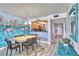 Bright dining area adjacent to the kitchen with a flamingo mural at 7564 Bayshore Dr # 202, Treasure Island, FL 33706