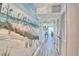 Inviting hallway with coastal-themed decor and modern flooring at 7564 Bayshore Dr # 202, Treasure Island, FL 33706
